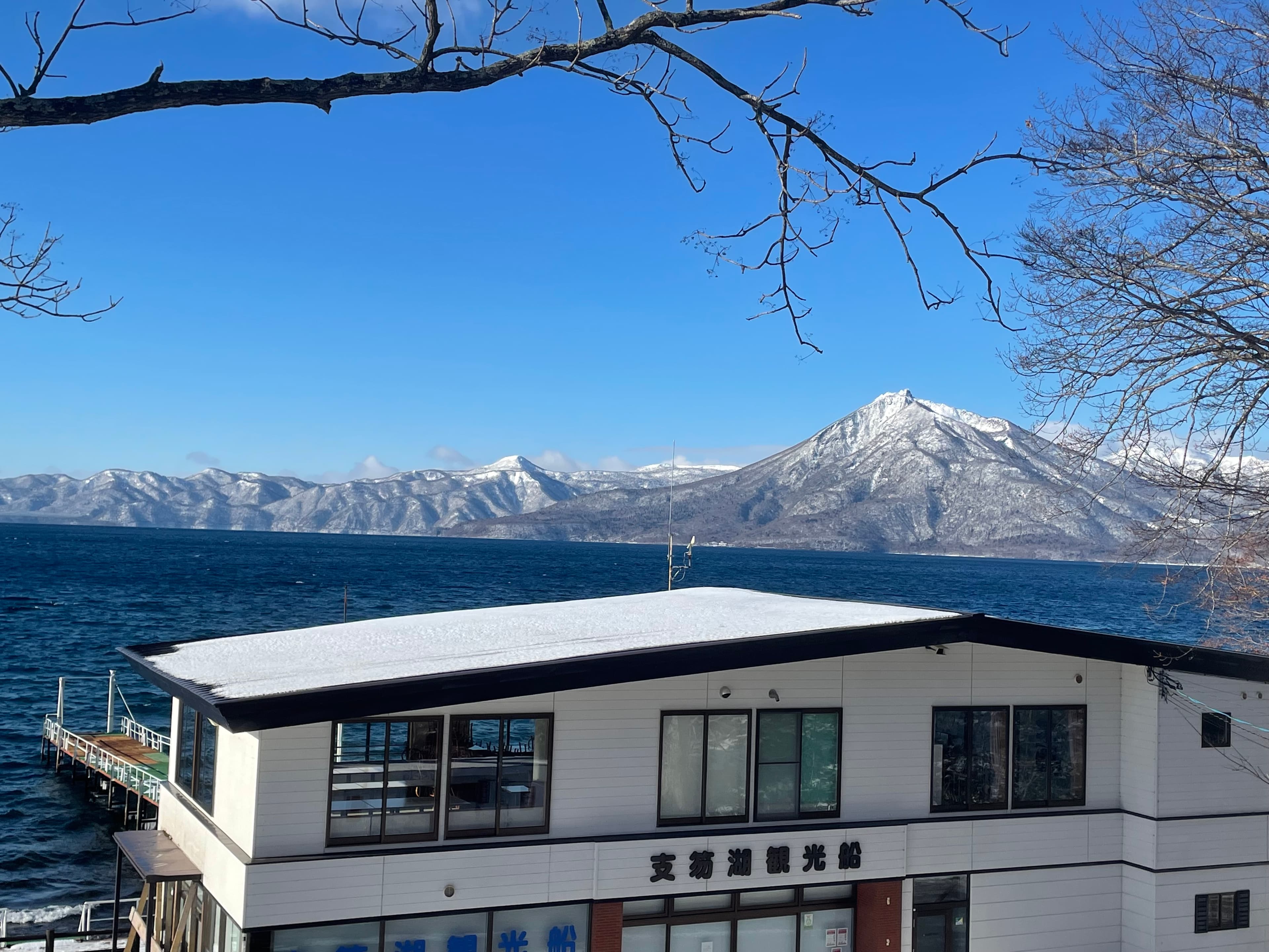 Snowy mountain view over Lake Shikotsu